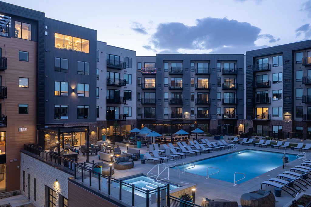 night shot of pool at centennial apartments