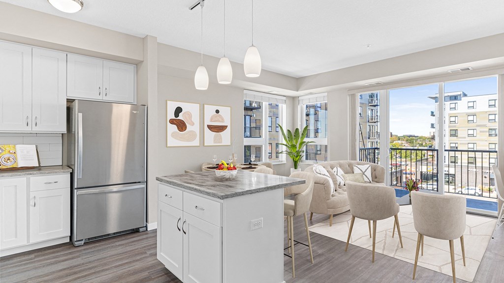 a kitchen with a island and a living room