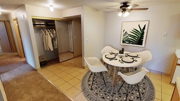Dining Room with Circular Table and Rug, Coat Closet - Photo Gallery 4