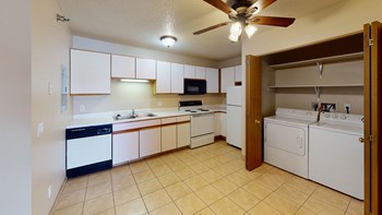 Kitchen with White Cabinets and Closeted Washer Dryer - Photo Gallery 2