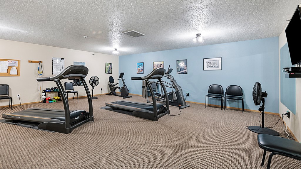 our gym has plenty of exercise equipment and chairs for residents to use