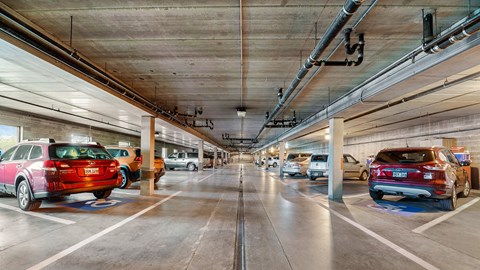 an empty parking garage with cars parked in it