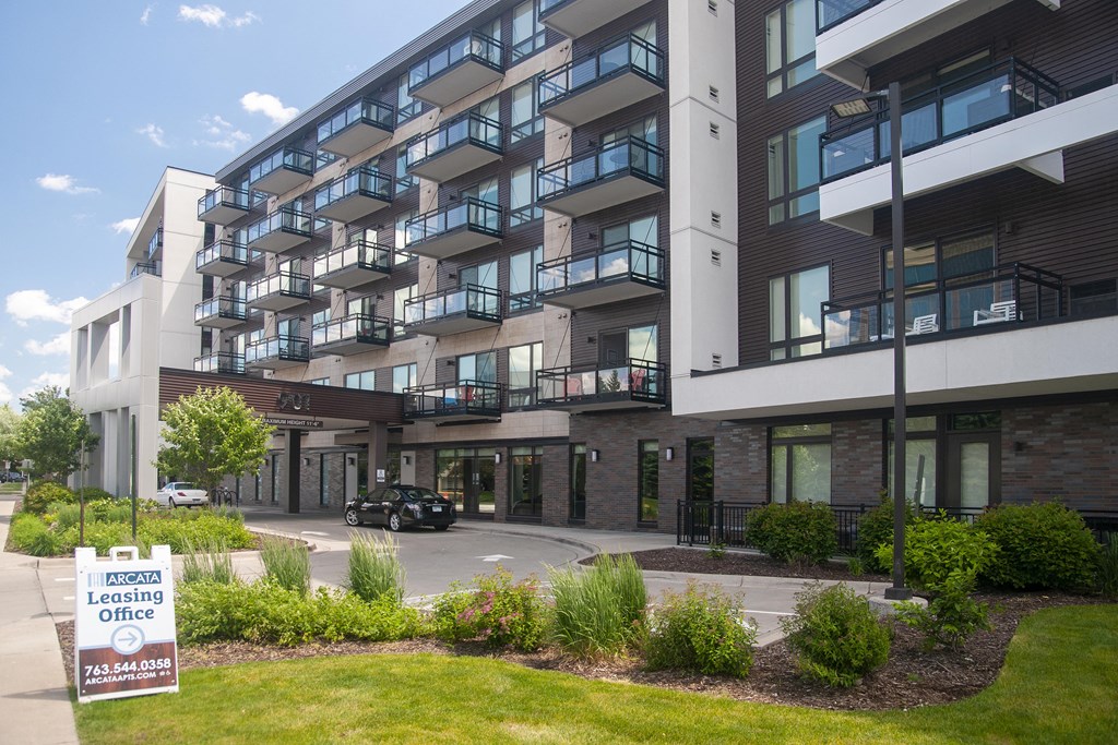 Exterior of Arcata Apartments and the spacious balconies against blue sky.