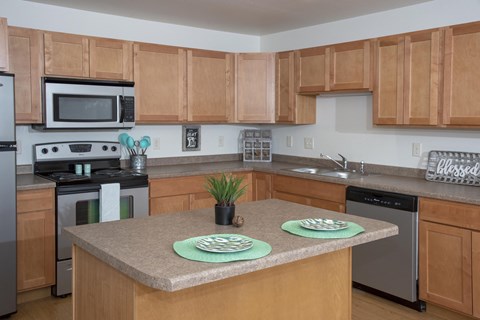 Kitchen with Wood Cabinets and Island