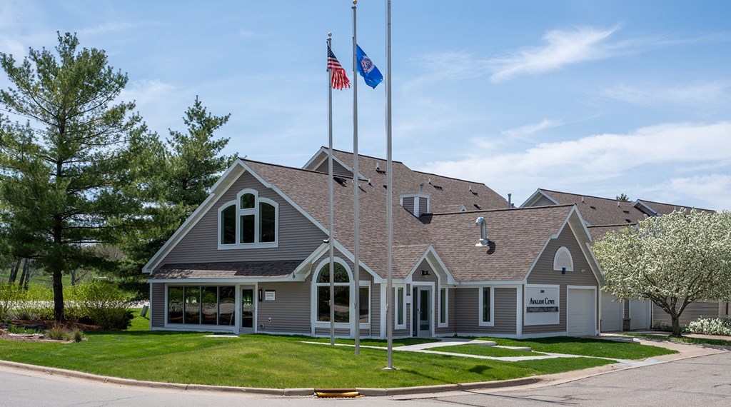 a house with two flags on the roof
