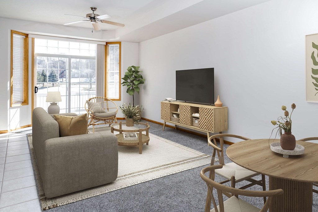 a living room with white walls and a sliding glass door