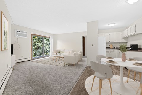 A modern living room with a dining table set up.