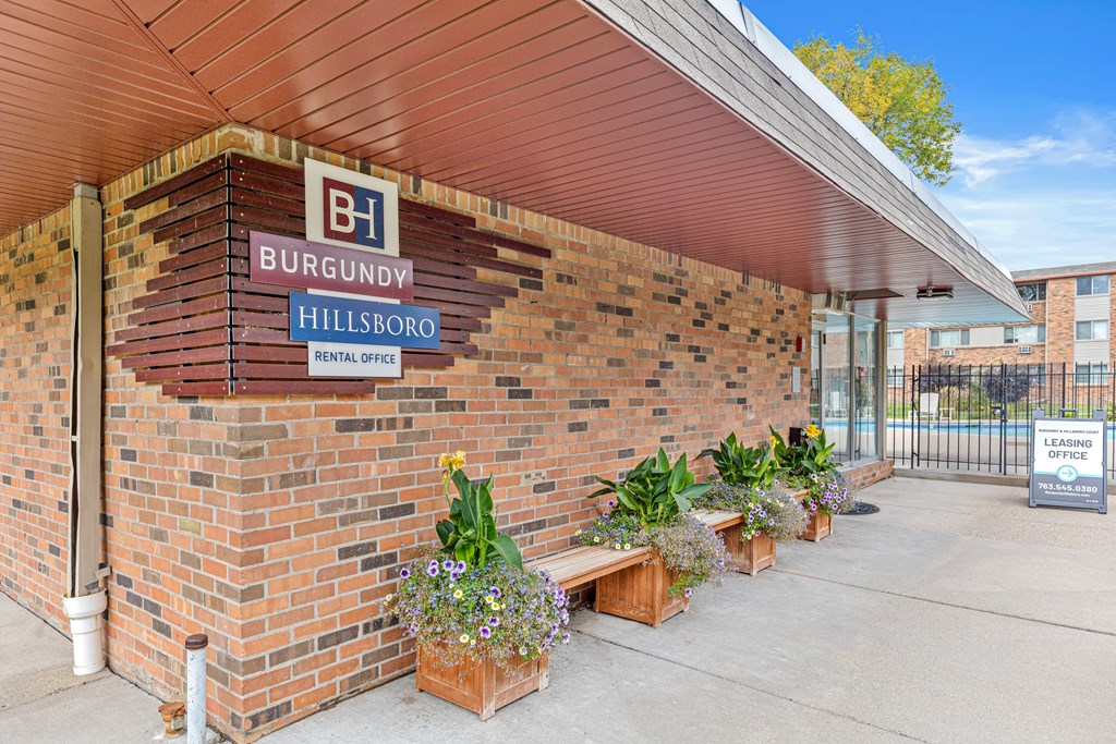 A building with a sign that says Burgundy Hillsboro Rental Office.