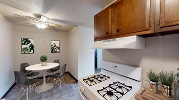 Kitchen with Wood Cabinets and Circular Dining Table - Photo Gallery 3