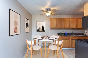 Kitchen with Wood Cabinets and Circular Dining Table - Photo Gallery 2