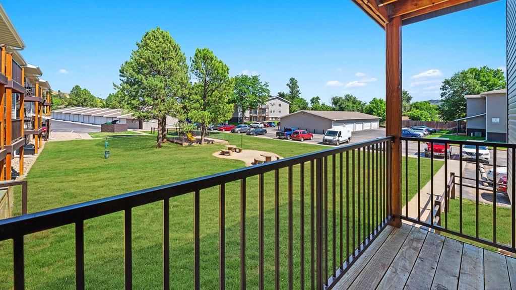a view of the yard from the balcony of a house