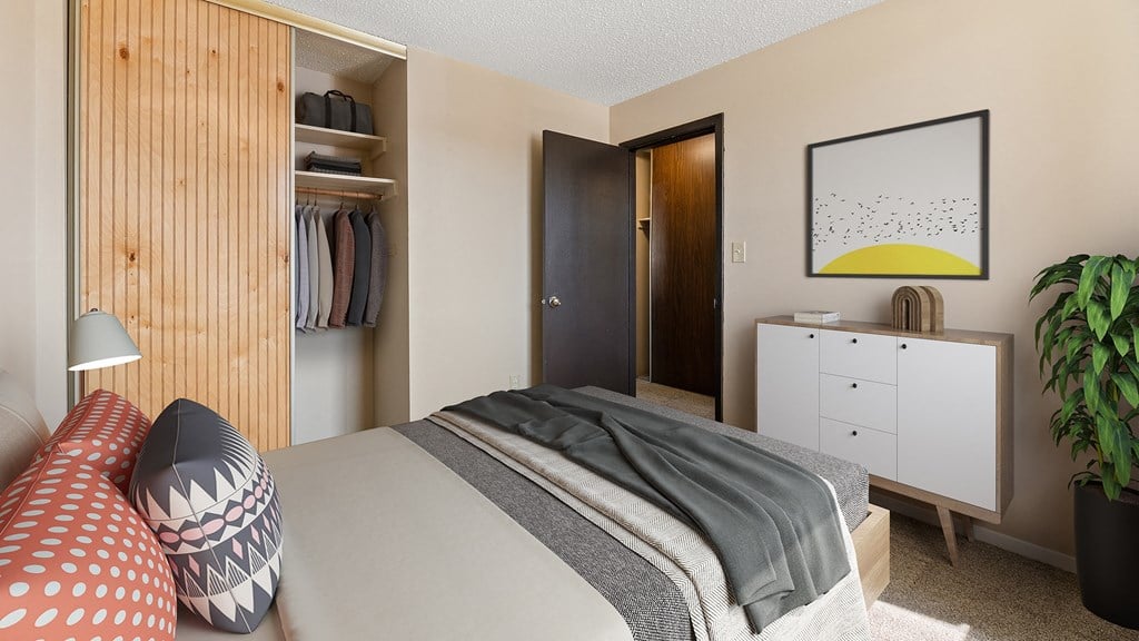 a bedroom with a bed and a closet