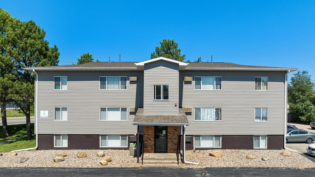 an image of a house with a blue sky in the background