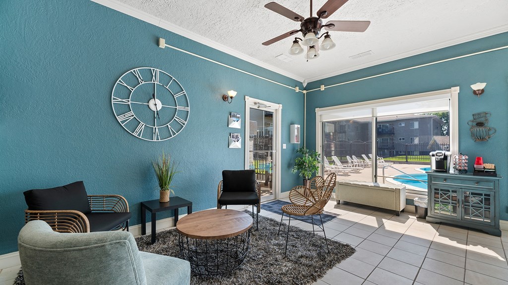 a living room with a large clock on the wall