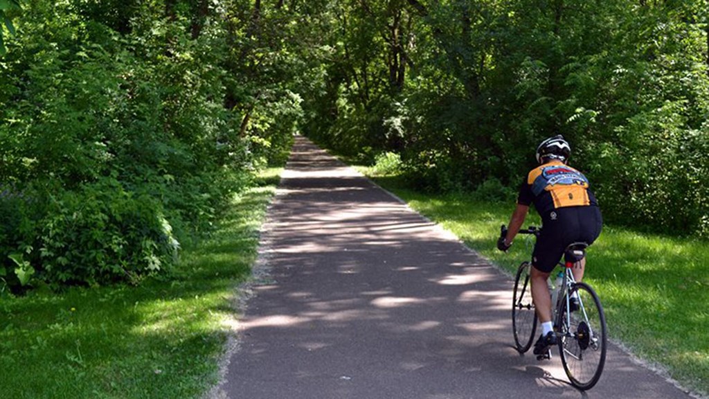 a person riding a bike down a path
