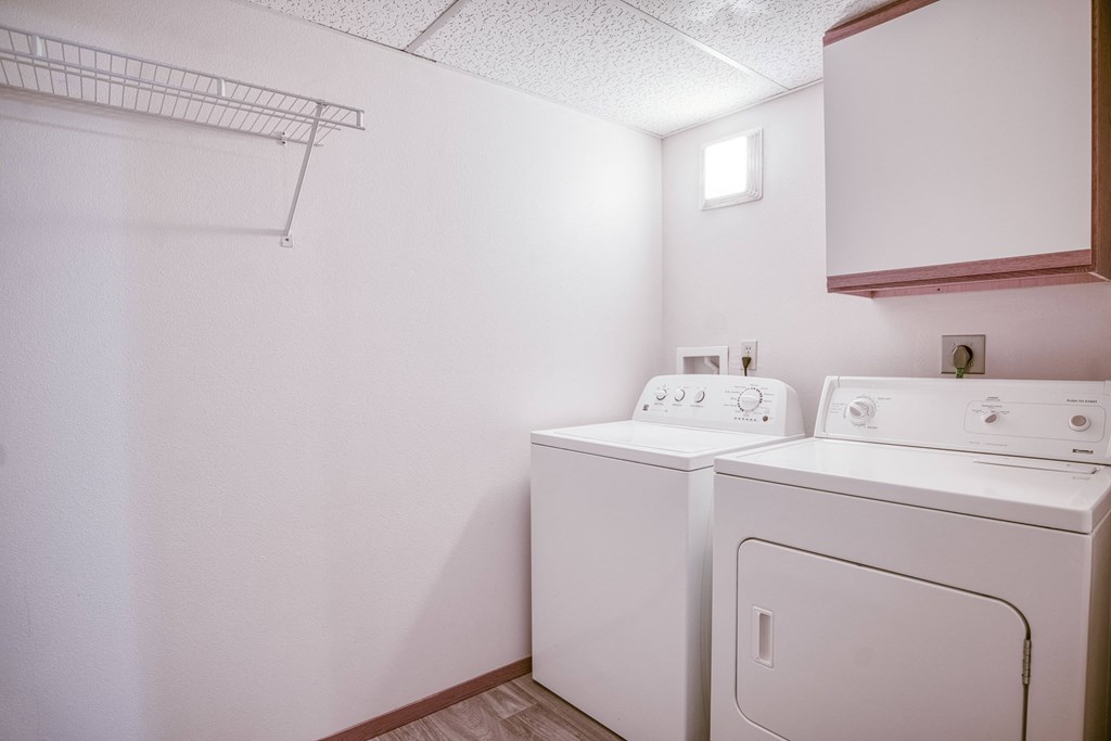 our apartments have a washer and dryer in the living room and laundry room