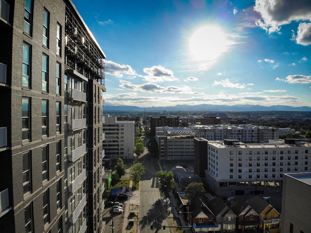 Exterior view of Civic Lofts building with gleaming sun
