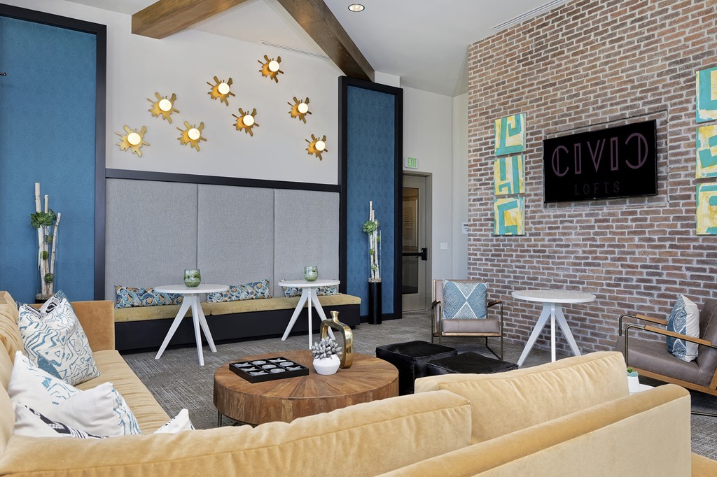 Community space with decor, Television and yellow sectional couch