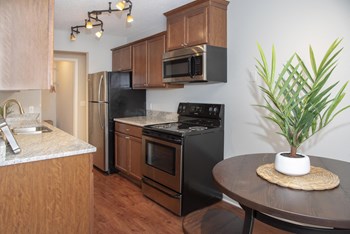 Bright kitchen with classic finishes and updated stainless steel appliances. - Photo Gallery 2
