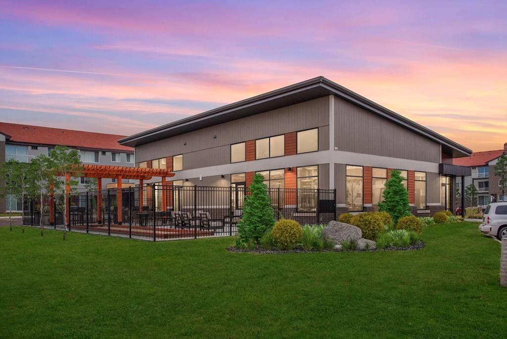 Exterior of Colonial Villa clubhouse complete with outdoor patio.