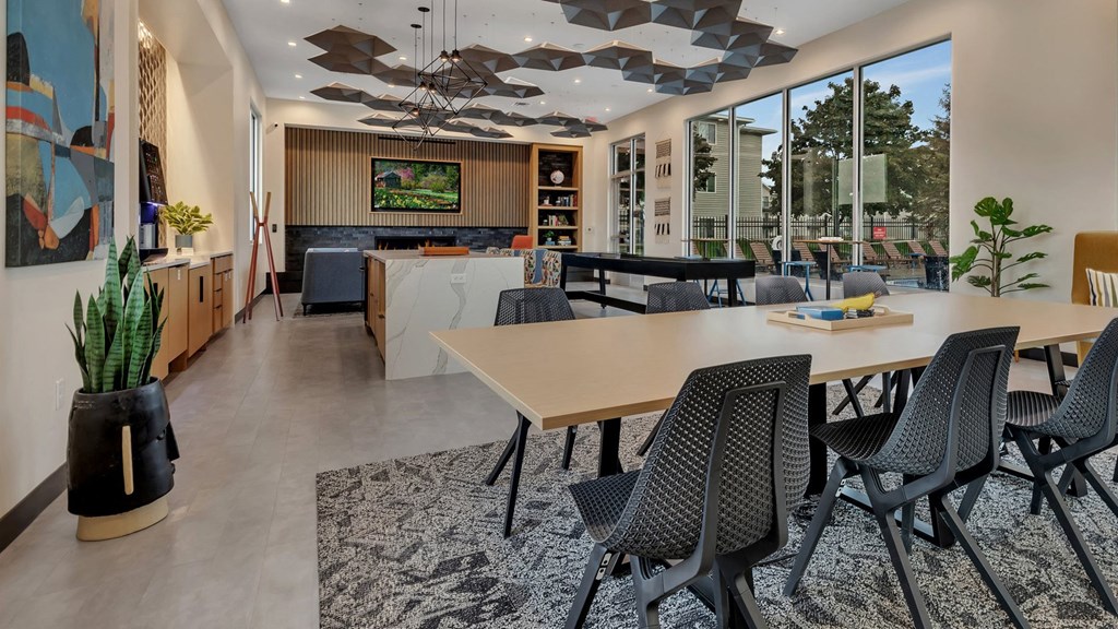 a dining room with a table and chairs