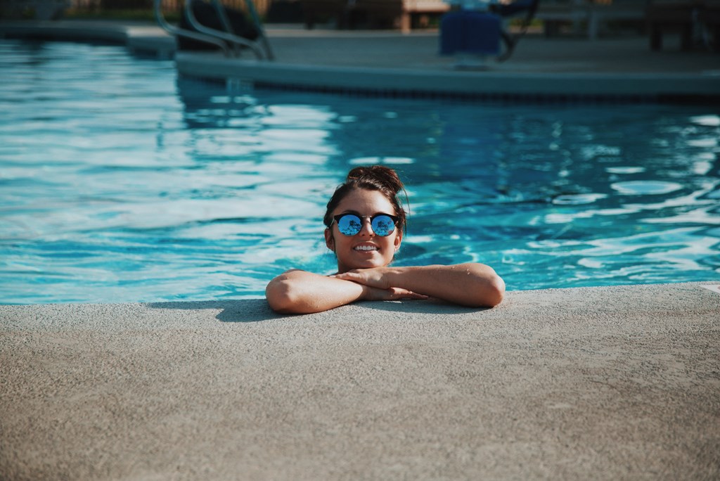 a boy in a swimming pool