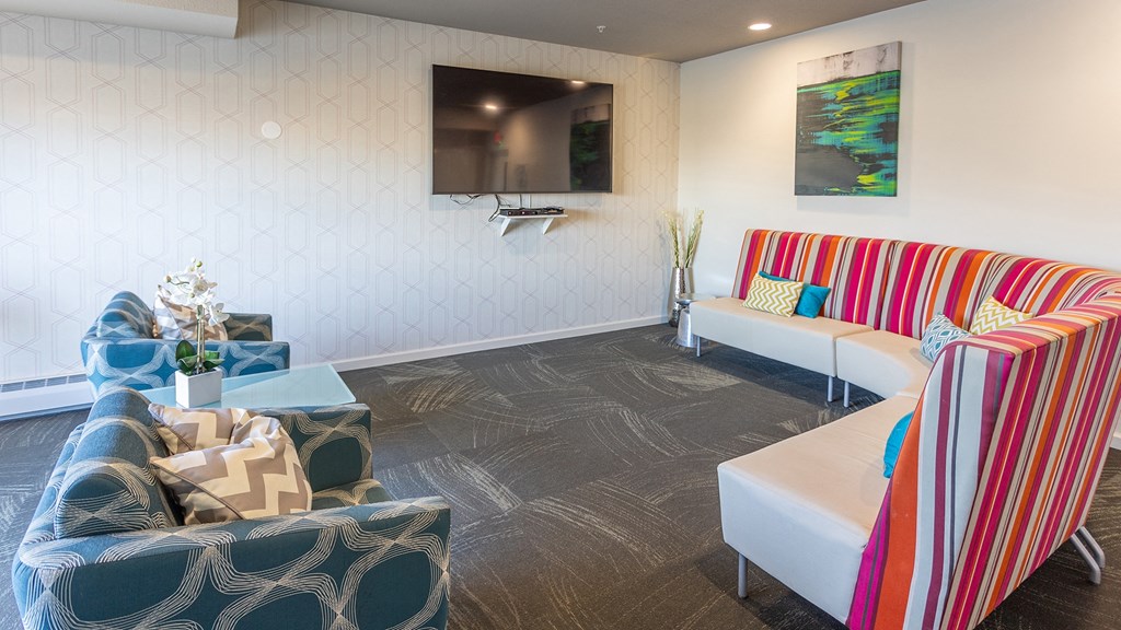 a living room with couches and a television