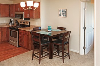 Small Dining Table with Chairs Next to Kitchen - Photo Gallery 3