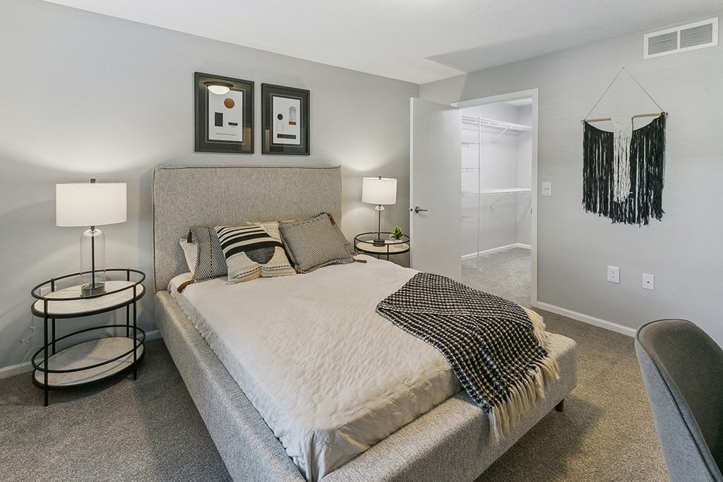 a bedroom with a bed and a close at The Donovan Apartment Homes, Lincoln, NE, 68516