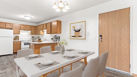 our modern kitchen and dining room with a white table and chairs