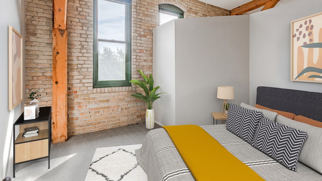 a bedroom with a bed and a window