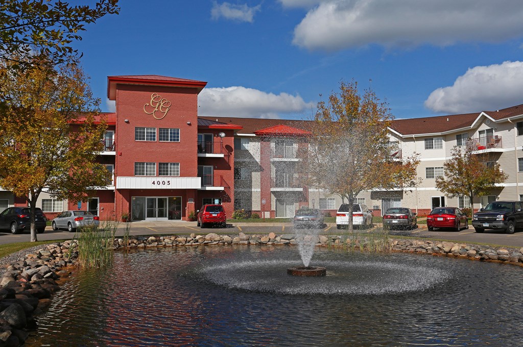 Exterior Grand Gateway Apartments Building and Fountain Pool