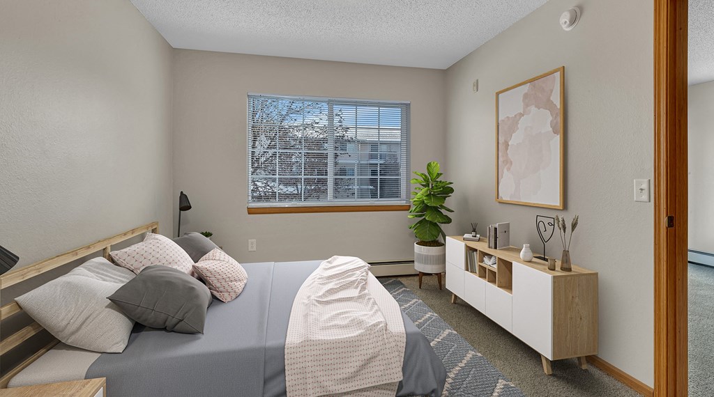 an example of a bedroom with a bed and a window