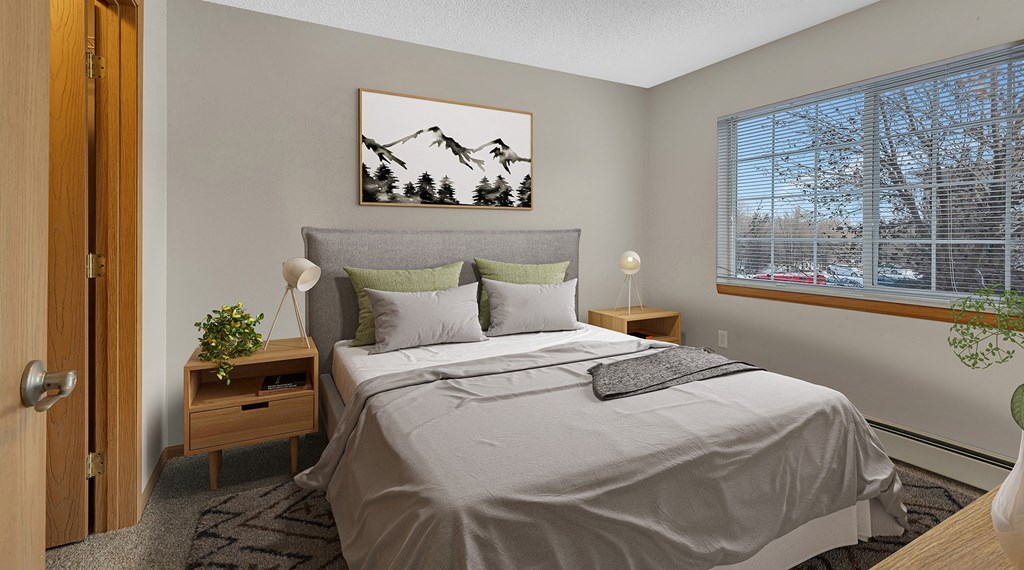 a bedroom with a large bed and a window