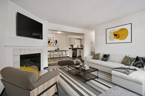 Furnished Living Room with Large Couch, Coffee Table and TV