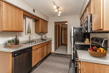 Full Kitchen with Wood Cabinets, Appliances and Rug - Photo Gallery 4
