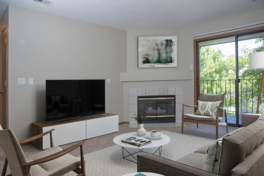 Furnished Living Room with Fireplace and Sliding Glass Door
