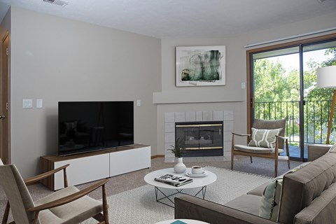 Furnished Living Room with Fireplace and Sliding Glass Door