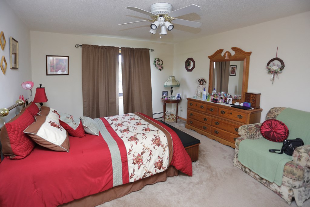 Spacious bedrooms with large windows and natural light.