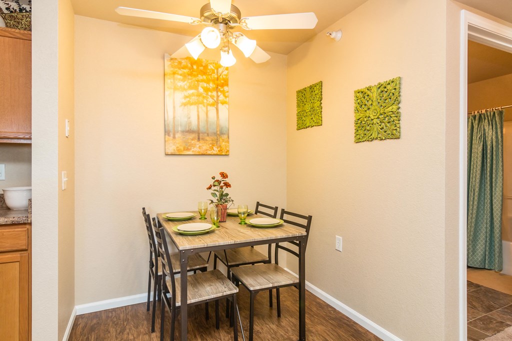 Separate dining space off the kitchen with overhead lighting.