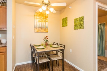 Separate dining space off the kitchen with overhead lighting. - Photo Gallery 4
