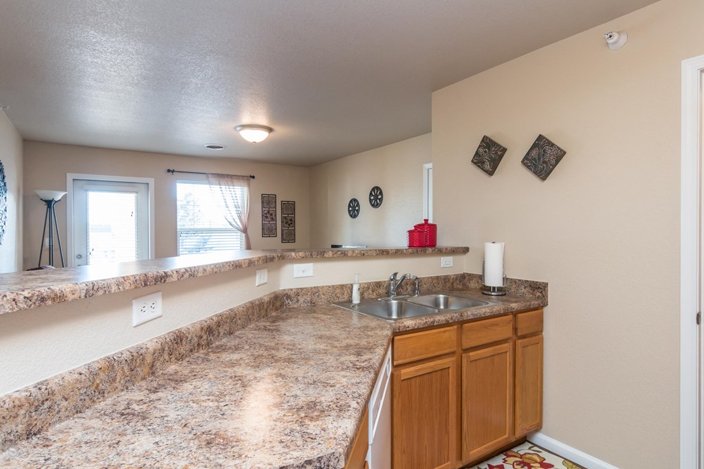 Kitchen featuring tons of counterspace wrapping around the kitchen with breakfast bar area.
