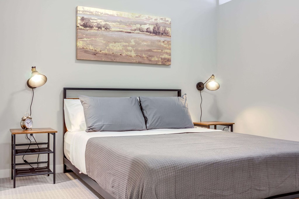 Elegant and spacious bedroom with high ceilings.