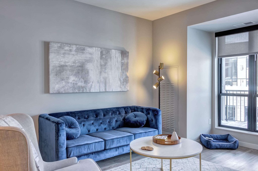 Spacious living rooms leading out to a private balcony with views of the golf course and pool deck.