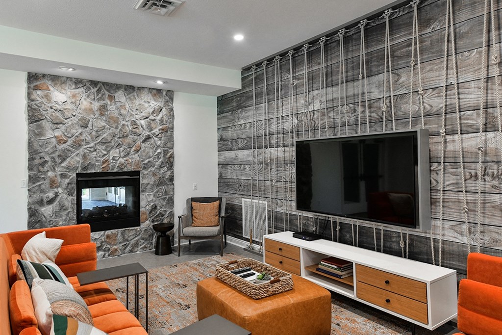 a living room with a tv and a fireplace