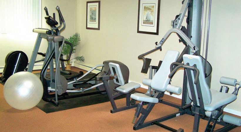 Enjoy our on site fitness center with a variety of cardio and strength equipment available for use. - Photo Gallery 1