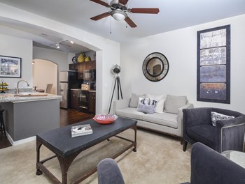 Well lit open living room that leads into the modern kitchen. - Photo Gallery 2
