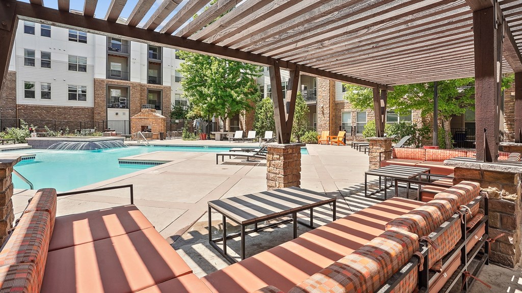 our apartments have a resort style pool and lounge furniture
