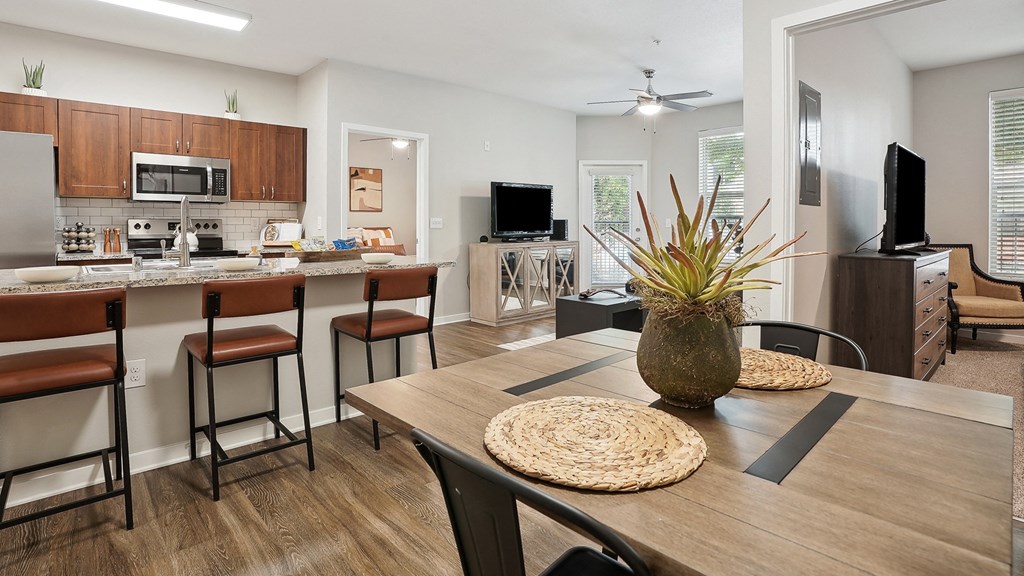 an open kitchen and dining room with a table and chairs