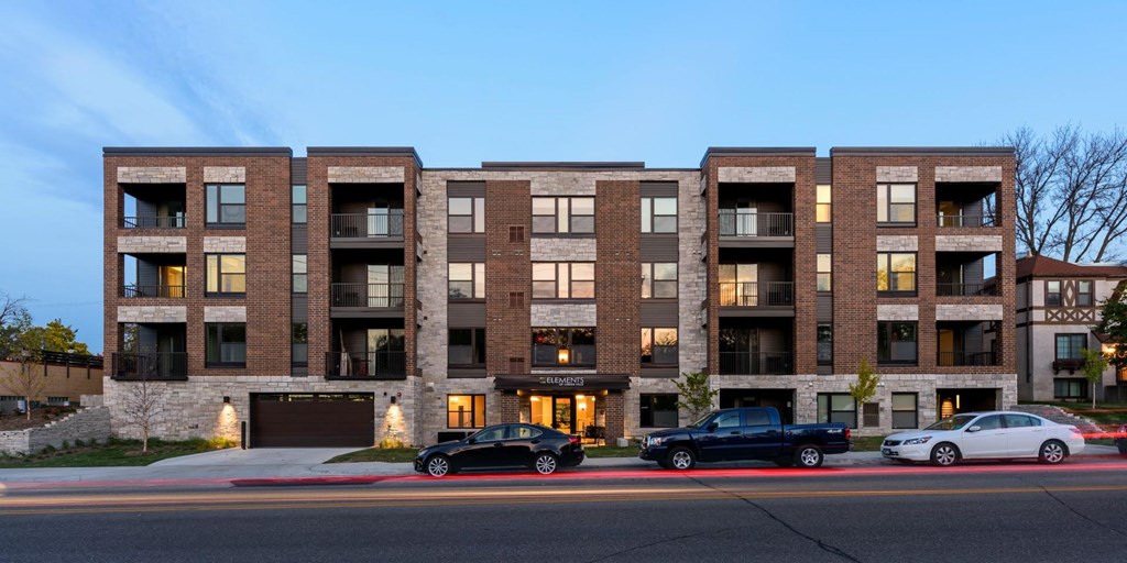 Exterior view of Elements on Linden Hill, three cars parked on near street entrance